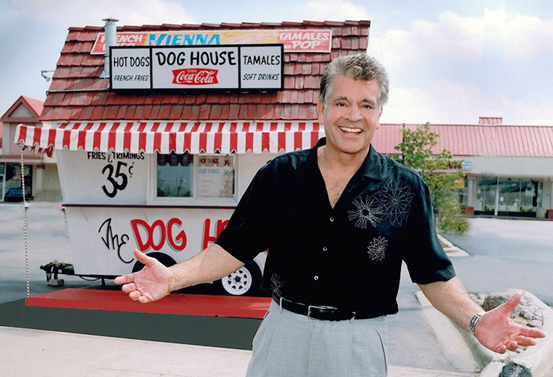 Dick Portillo in front of a replica of the original Portillo's "Dog House"