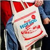 Portillo's Hot Dog Season tote bag carried alongside a blue drawstring backpack