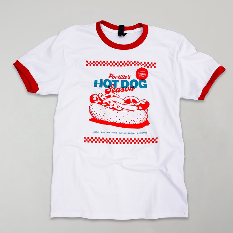 White ringer T-shirt with red trim and &ldquo;Portillo's Hot Dog Season&rdquo; graphic in red and blue.