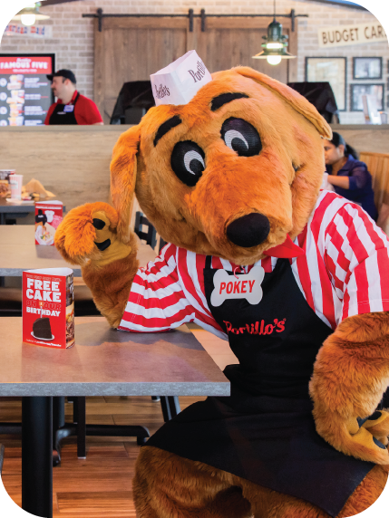 Pokey mascot sitting at a table