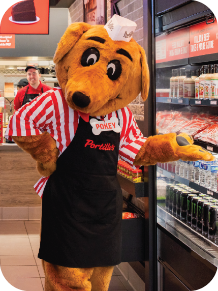 Pokey standing next to a grab 'n' go station at a Portillo's restaurant
