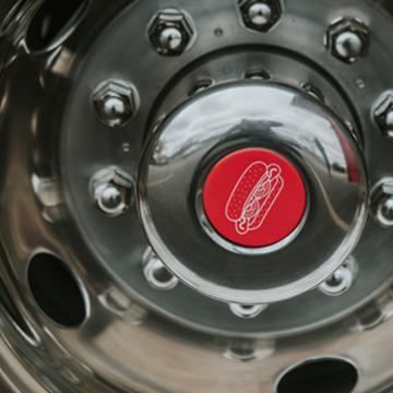 Close up of beef bus wheel with hot dog hub cap