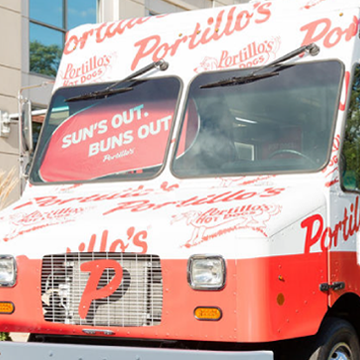 front view of beef bus food truck with sign in windshield that says 